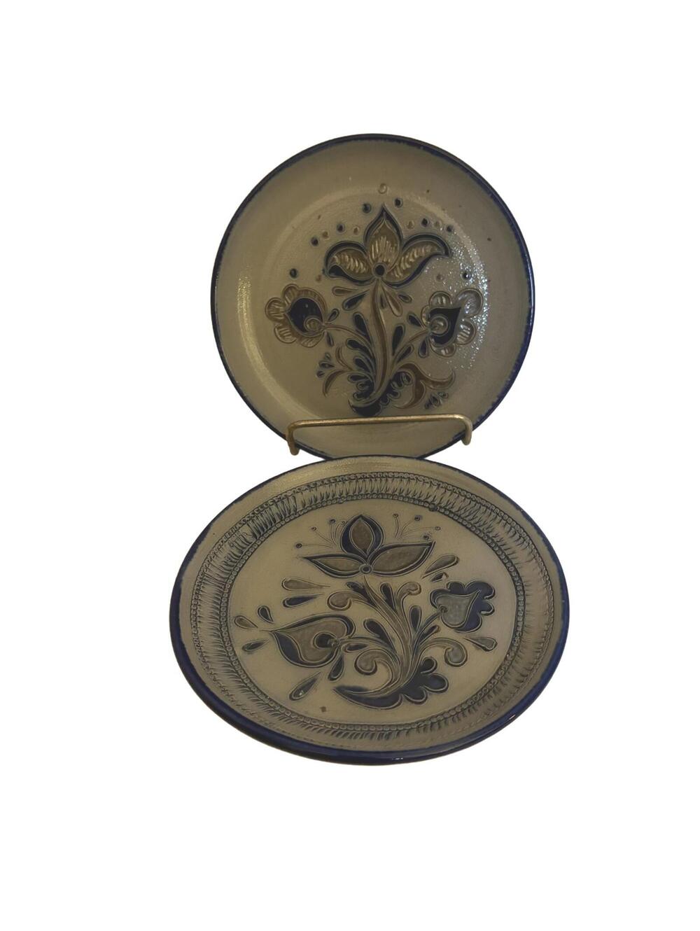 Two PLEWA German salt-glazed stoneware plates with floral motifs & blue accents
